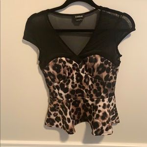 Bebe cheetah print and mesh peplum top.